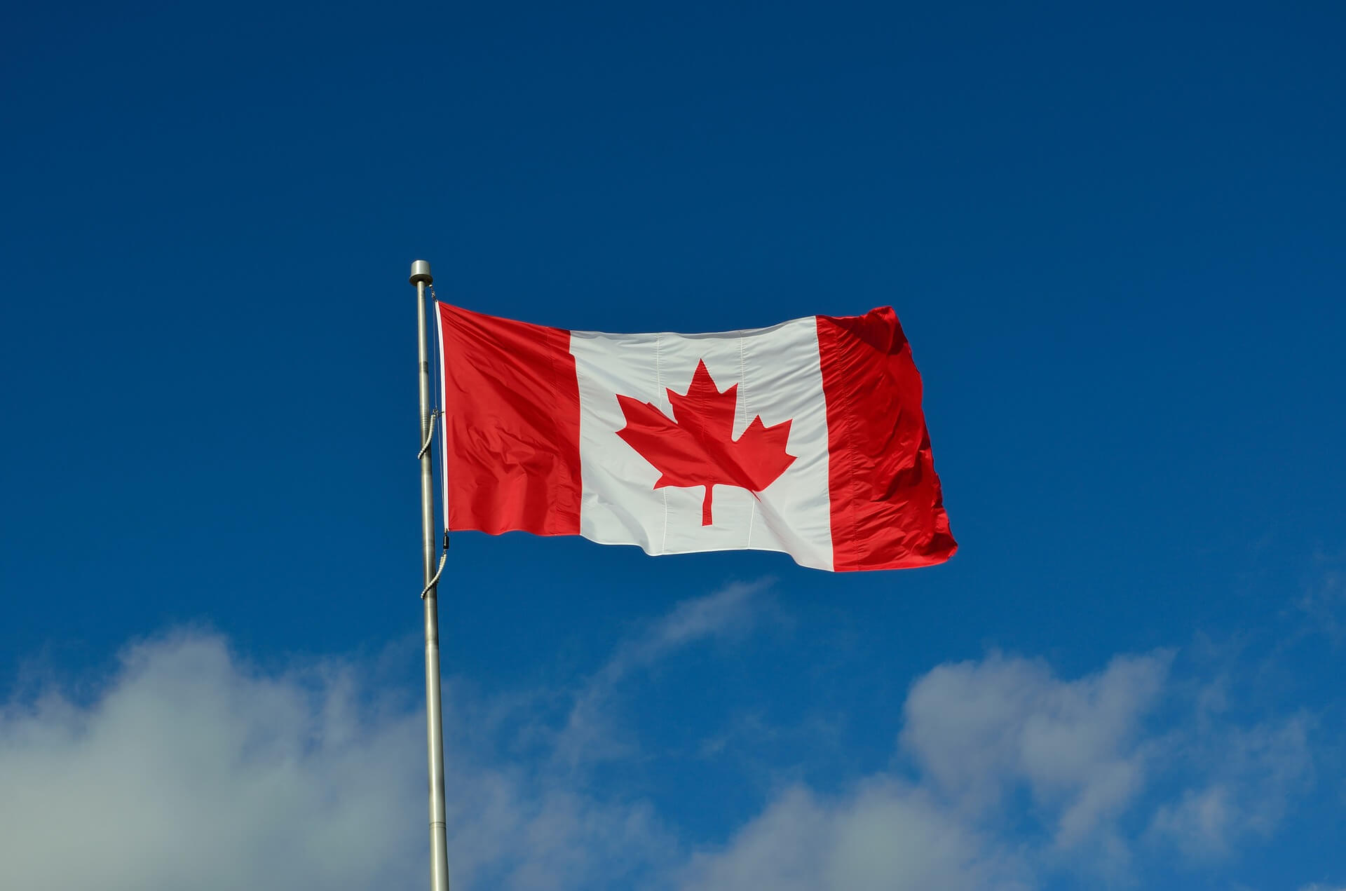 canadian flag blue sky
